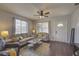 Spacious living room with hardwood floors, comfortable seating and large windows at 2701 W Cordelia St, Tampa, FL 33607