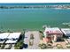 Aerial view of waterfront property with homes and a parking area at 289 Monte Cristo Blvd, St Petersburg, FL 33715