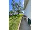 Backyard with mature tree, grassy lawn, and garden at 289 Monte Cristo Blvd, St Petersburg, FL 33715