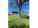Large backyard with mature tree and grassy area at 289 Monte Cristo Blvd, St Petersburg, FL 33715