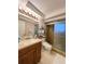 Bathroom with walk-in shower and updated vanity at 289 Monte Cristo Blvd, St Petersburg, FL 33715