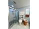 Bathroom with walk-in shower, toilet and linen cabinet at 289 Monte Cristo Blvd, St Petersburg, FL 33715