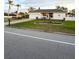 White single-story house with a two-car garage and landscaped lawn at 289 Monte Cristo Blvd, St Petersburg, FL 33715