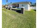 White house with a two-car garage, landscaping, and pillars at 289 Monte Cristo Blvd, St Petersburg, FL 33715