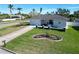 Single-story home with a well-manicured lawn and driveway at 289 Monte Cristo Blvd, St Petersburg, FL 33715