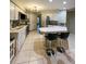 Kitchen boasts stainless steel appliances and an island with seating at 289 Monte Cristo Blvd, St Petersburg, FL 33715