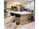 Kitchen with white cabinets and breakfast bar at 289 Monte Cristo Blvd, St Petersburg, FL 33715