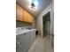 Laundry room with washer, dryer and cabinets at 289 Monte Cristo Blvd, St Petersburg, FL 33715