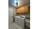 Laundry room with washer, dryer, and cabinets at 289 Monte Cristo Blvd, St Petersburg, FL 33715