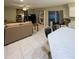 Bright living room with tile floors, large TV, and built-in shelving at 289 Monte Cristo Blvd, St Petersburg, FL 33715