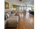 Living room with beige sectional sofa and hardwood floors at 289 Monte Cristo Blvd, St Petersburg, FL 33715