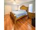 Spacious main bedroom featuring a king-size bed and wood floors at 289 Monte Cristo Blvd, St Petersburg, FL 33715