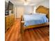 King-size bedroom with wood floors and large dresser at 289 Monte Cristo Blvd, St Petersburg, FL 33715