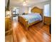 Main bedroom with wood floors, large bed, and ensuite bathroom at 289 Monte Cristo Blvd, St Petersburg, FL 33715