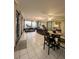 Multi-use screened porch with dining and office areas at 289 Monte Cristo Blvd, St Petersburg, FL 33715