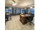 Bright screened porch with office, dining, and backyard views at 289 Monte Cristo Blvd, St Petersburg, FL 33715
