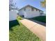 Side of house with walkway and fenced yard at 289 Monte Cristo Blvd, St Petersburg, FL 33715