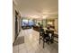 Sunroom with tiled floor, treadmill, and access to backyard at 289 Monte Cristo Blvd, St Petersburg, FL 33715