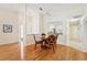 Dining area with hardwood floors and a four-person table at 3340 Mcmath Dr, Palm Harbor, FL 34684