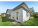 White house exterior with grey roof and landscaping at 3340 Mcmath Dr, Palm Harbor, FL 34684