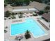 Large community pool with lounge chairs and patio area at 3340 Mcmath Dr, Palm Harbor, FL 34684