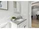 Modern bathroom with gray vanity, updated sink and fixtures at 3513 Gray Whetstone St, Brandon, FL 33511