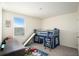 bedroom with bunk bed, built-in play area, and a desk at 38311 Sonnet Landing Ave, Zephyrhills, FL 33540
