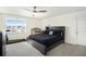 Bedroom with a king-size bed and a crib at 38311 Sonnet Landing Ave, Zephyrhills, FL 33540