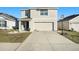 Two-story house with a two-car garage at 38311 Sonnet Landing Ave, Zephyrhills, FL 33540