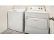 Bright laundry room with washer and dryer at 38311 Sonnet Landing Ave, Zephyrhills, FL 33540