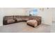 Spacious living area with a large sectional sofa perfect for relaxation at 38311 Sonnet Landing Ave, Zephyrhills, FL 33540