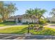 House exterior with palm trees and circular driveway at 4098 Las Palmas Way, Sarasota, FL 34238