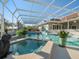 Relaxing spa with adjacent pool and covered patio area at 4098 Las Palmas Way, Sarasota, FL 34238