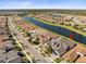 Aerial view of the house and surrounding waterfront community at 4719 Avila Lakes Dr, Wimauma, FL 33598