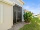Screened patio and lush landscaping at 4719 Avila Lakes Dr, Wimauma, FL 33598