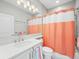 Clean bathroom with a shower/tub combo and updated vanity at 4719 Avila Lakes Dr, Wimauma, FL 33598
