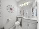 Powder room with a single vanity and contemporary design at 4719 Avila Lakes Dr, Wimauma, FL 33598