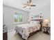Cozy bedroom with a comfortable bed and ceiling fan at 4719 Avila Lakes Dr, Wimauma, FL 33598
