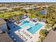 Large community pool with lap lanes and plenty of lounge chairs at 4719 Avila Lakes Dr, Wimauma, FL 33598