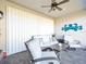 Relaxing covered patio with seating area, perfect for outdoor enjoyment at 4719 Avila Lakes Dr, Wimauma, FL 33598