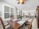 Dining room with table and chairs, open to kitchen with island at 4719 Avila Lakes Dr, Wimauma, FL 33598