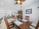 Open concept dining room with kitchen view, seating for six at 4719 Avila Lakes Dr, Wimauma, FL 33598