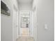 Clean hallway with light walls and carpet flooring at 4719 Avila Lakes Dr, Wimauma, FL 33598