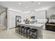 Spacious kitchen with island and white cabinets at 4719 Avila Lakes Dr, Wimauma, FL 33598