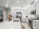Modern kitchen with stainless steel appliances and white cabinetry at 4719 Avila Lakes Dr, Wimauma, FL 33598