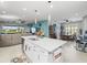 Open kitchen features a large island and breakfast nook at 4719 Avila Lakes Dr, Wimauma, FL 33598