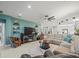 Gathering room with sectional sofa, TV, and access to kitchen at 4719 Avila Lakes Dr, Wimauma, FL 33598