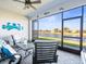 Relaxing screened patio overlooking a lake at 4719 Avila Lakes Dr, Wimauma, FL 33598