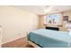 Spacious bedroom with a full bed, window, and wood flooring at 4880 Locust Ne St # 227, St Petersburg, FL 33703