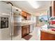 Kitchen with stainless steel appliances and wood cabinets at 4880 Locust Ne St # 227, St Petersburg, FL 33703